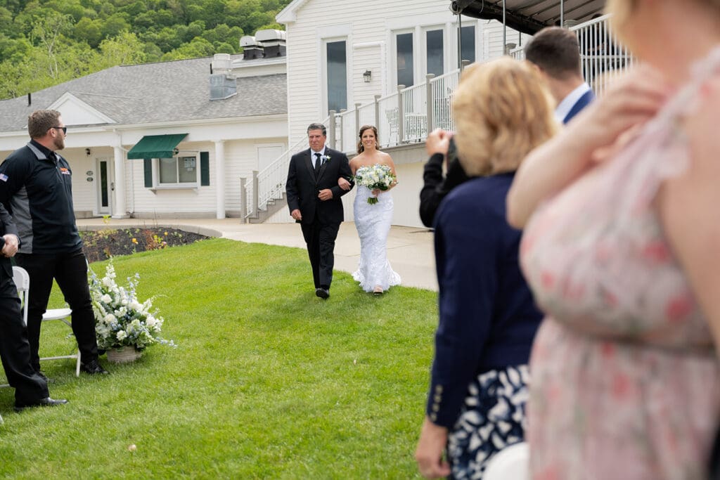bride and dad walking down the aisle