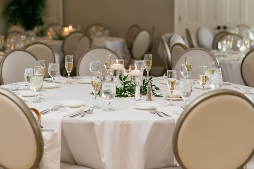 table complete with greenery and glassware