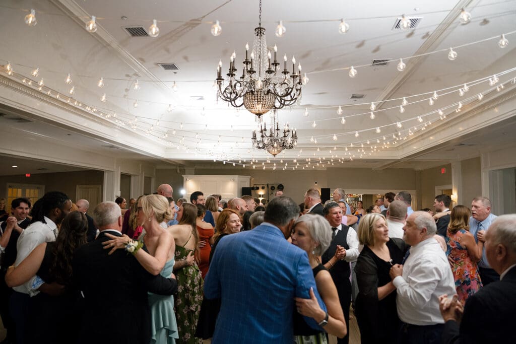 packed dance floor at a country club wedding