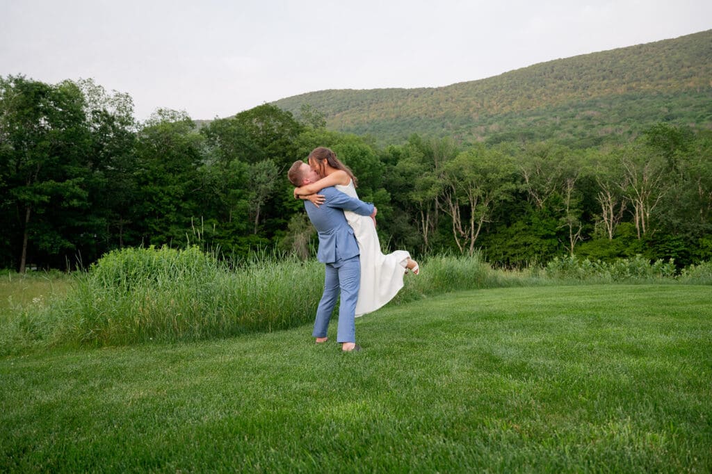 Newlyweds dance in the meadow at Bloom Meadows