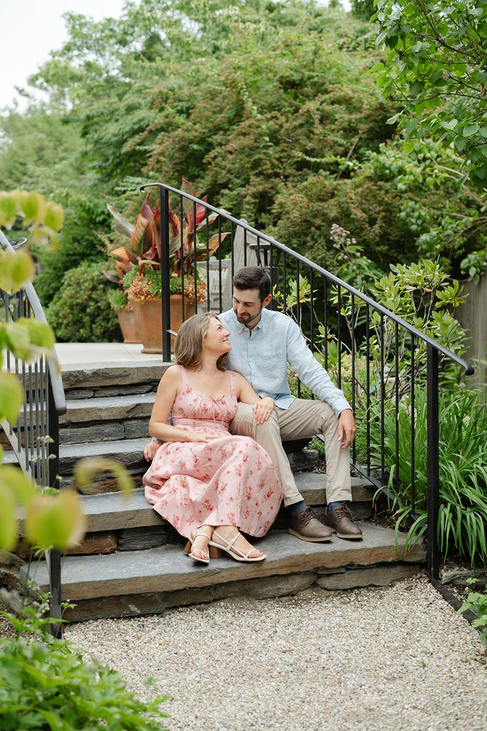 Couple wearing soft, summer colors for an outdoor engagement session